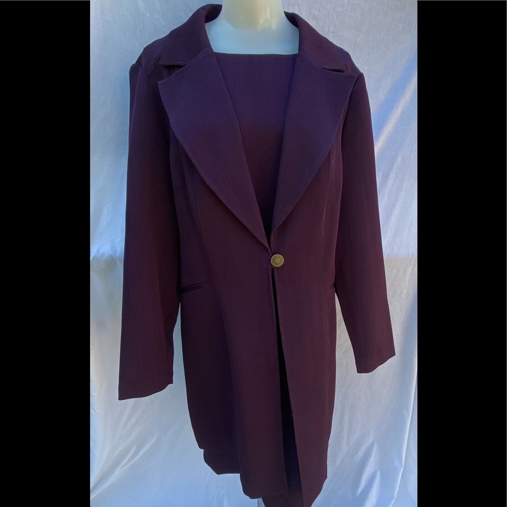 Two piece woman’s dark purple dress with jacket